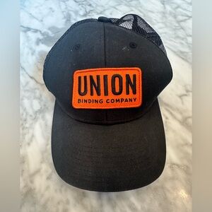 Union Binding Company Black Patch Trucker Hat
